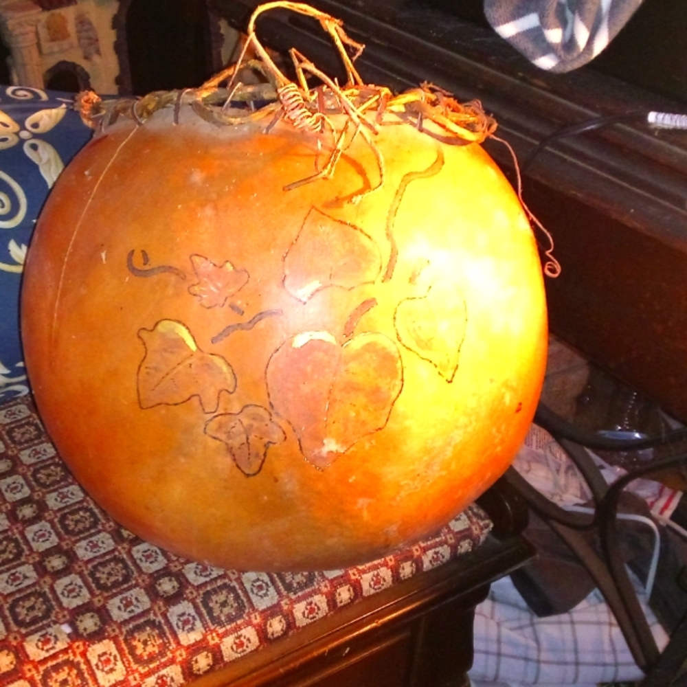 Pair Native American gourds  made into storage containers and painted decorated